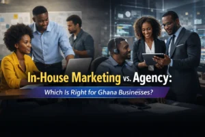 Banner for blog post about In-House Marketing vs Agency in Ghana for businesses, with professionals discussing marketing strategies.